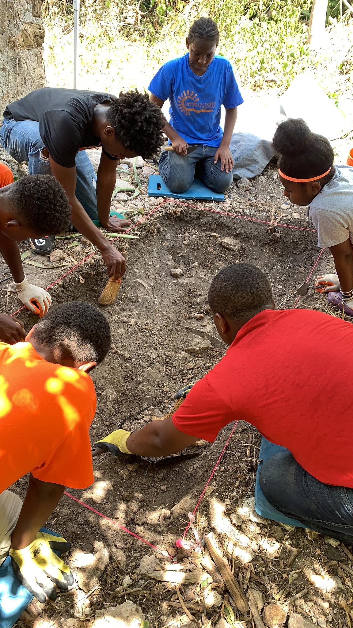 Crucian Students in the archaeological field school excavating a unit. Estate Little Princess, St. Croix, July 2019. Photo by Alexandra Jones, Archaeology in the Community.