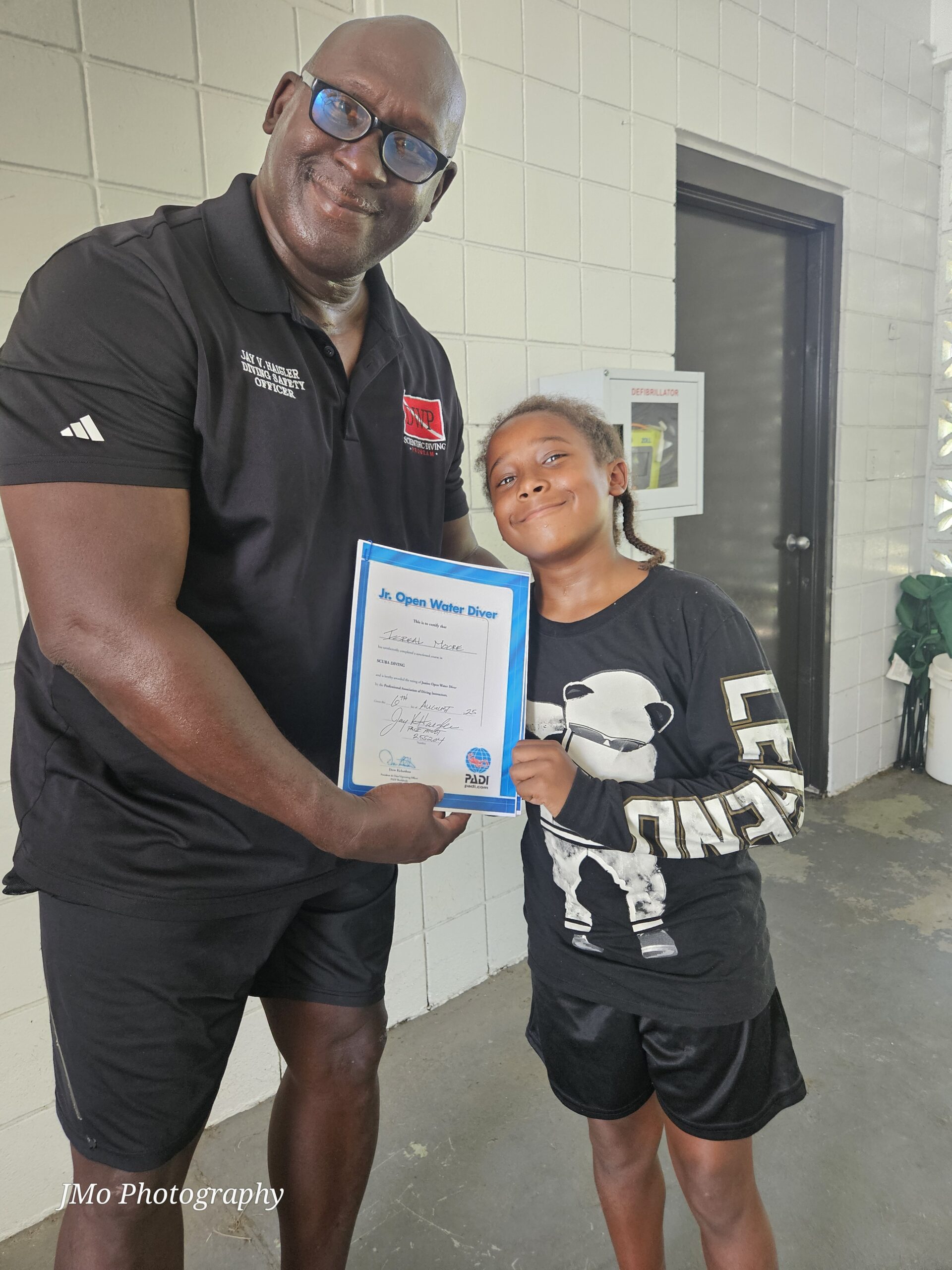 Man and boy shaking hands